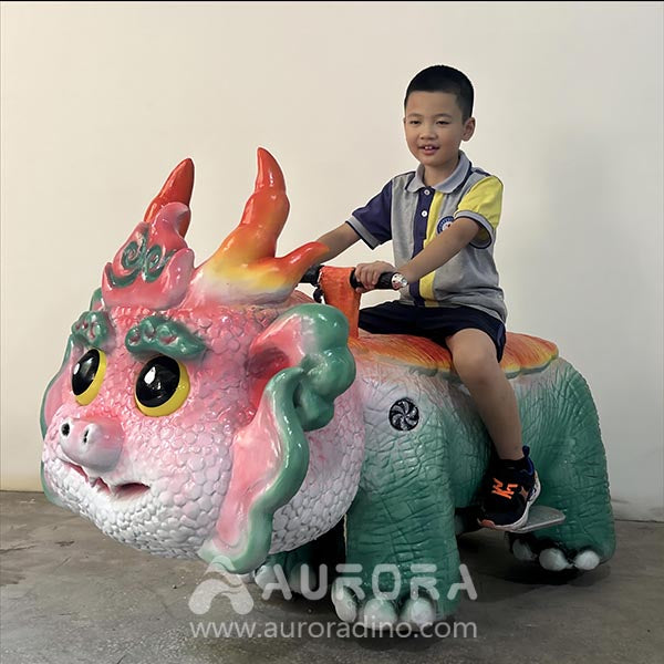 Pink Ankylosaurus Scooter Rides