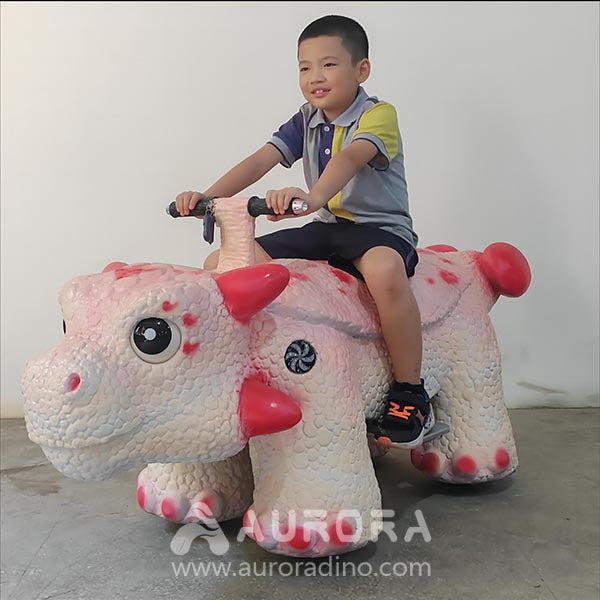 Pink Ankylosaurus Scooter Rides